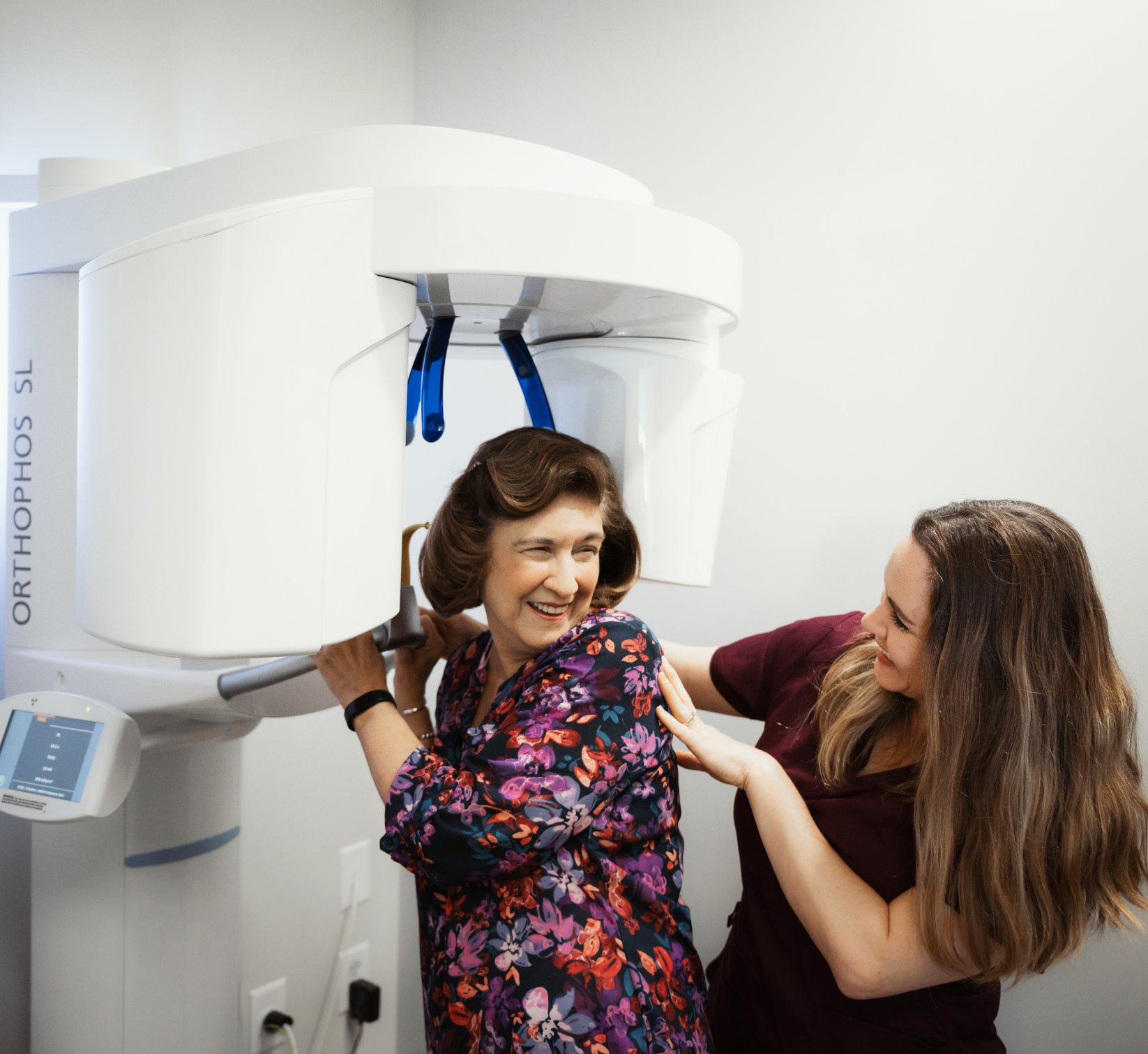 Hygienist helping an elderly patient get her X-Rays