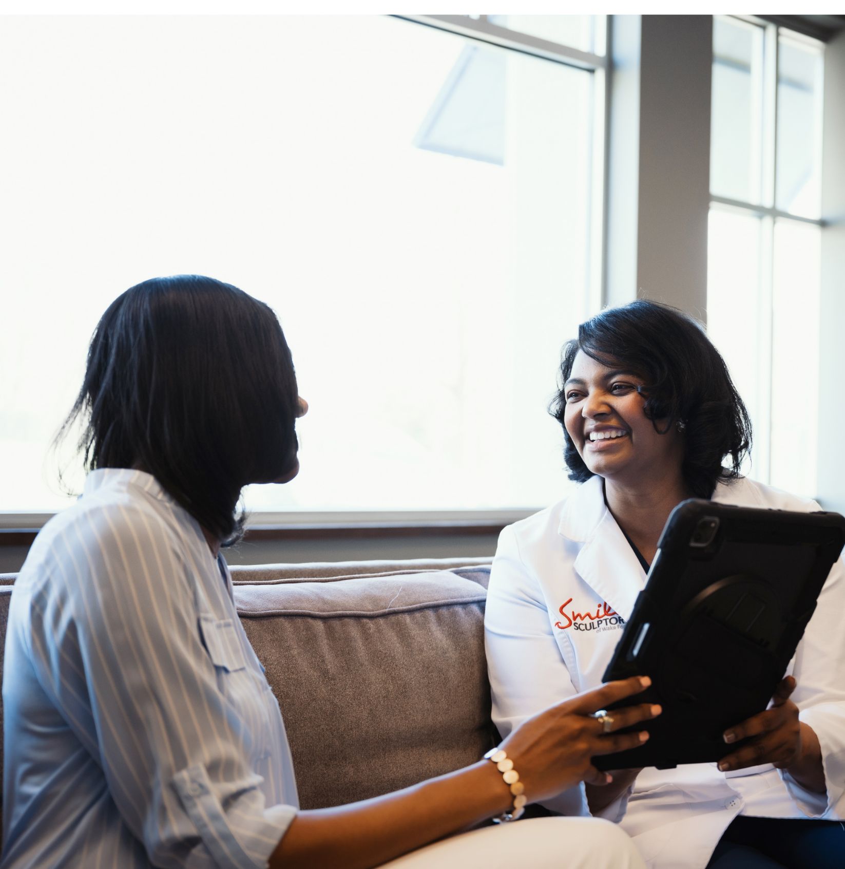 Dr. Shanean Anderson booking a patient for their next appointment